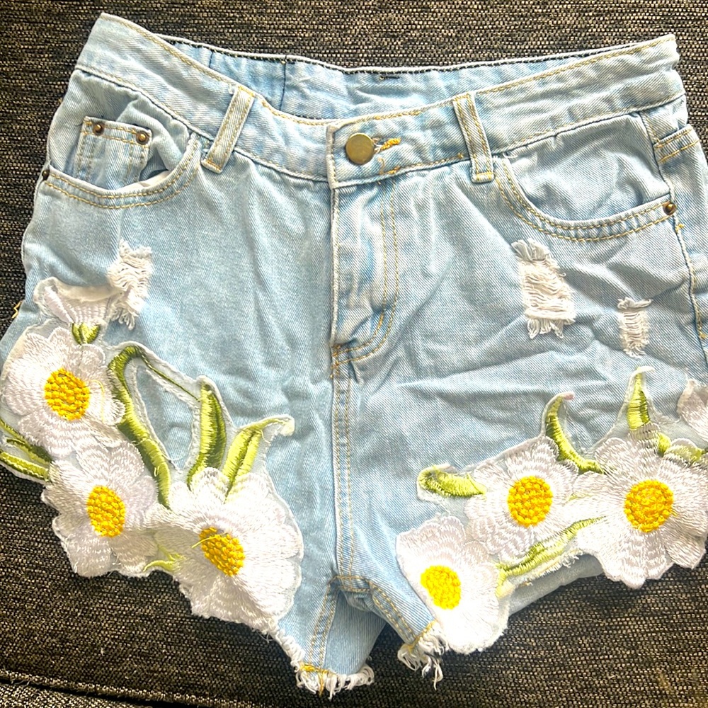 Size L but run more like a medium. Hand embroidered. Unique and beautiful.